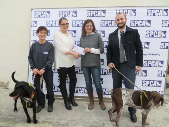 Atlas presents donation to SPCA